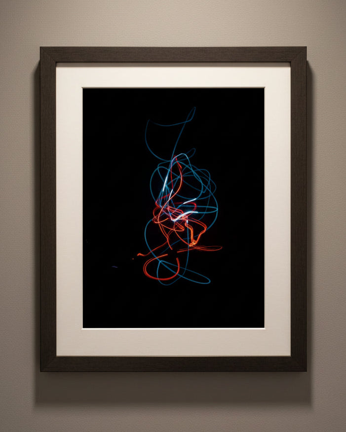 Framed art titled "El Amor y el Corazon", long exposure photography.